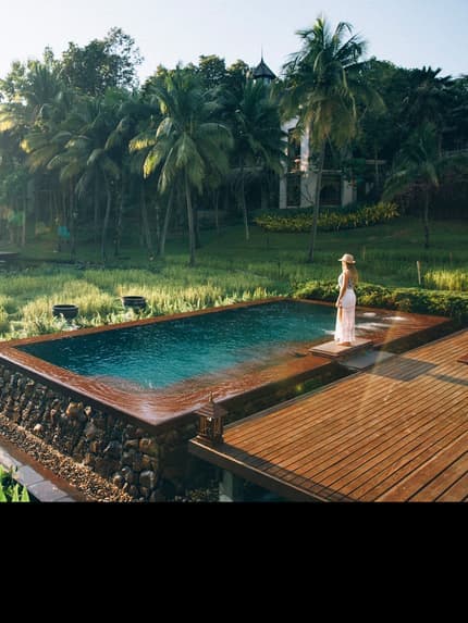 Four Seasons Resort Chiang Mai amid green rice fields